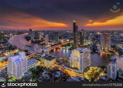 Landscape modern building near the river at sunset in Bangkok view of the bird.. Modern building near the river