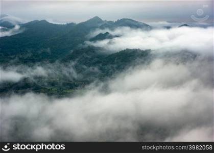 Landscape morning fog over on the mountain of Mae Moh Lampang, The most amazing Mist.. Mountain landscape with fog.