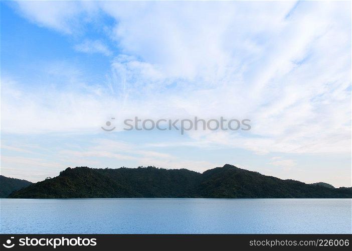 Landscape mountain and lake of Khun Dan Prakarn Chon Dam in Nakhon Nayok, Thailand on beautiful sky day.