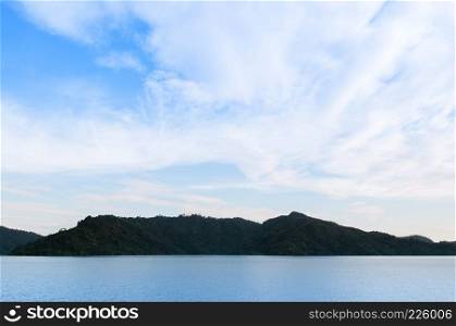 Landscape mountain and lake of Khun Dan Prakarn Chon Dam in Nakhon Nayok, Thailand on beautiful sky day.