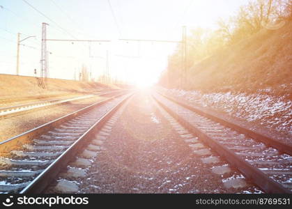 Landscape of a snowy Russian winter railway under bright sunlight The rails and sleepers under the December snow. Russian Railways in detail. Winter railroad landscape