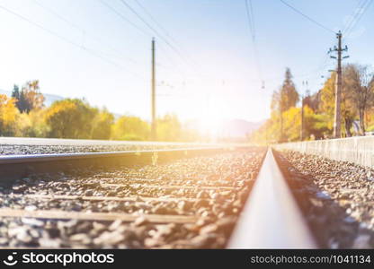 Landscape of an old abandoned railway in fall. Warm light, sustainable traveling