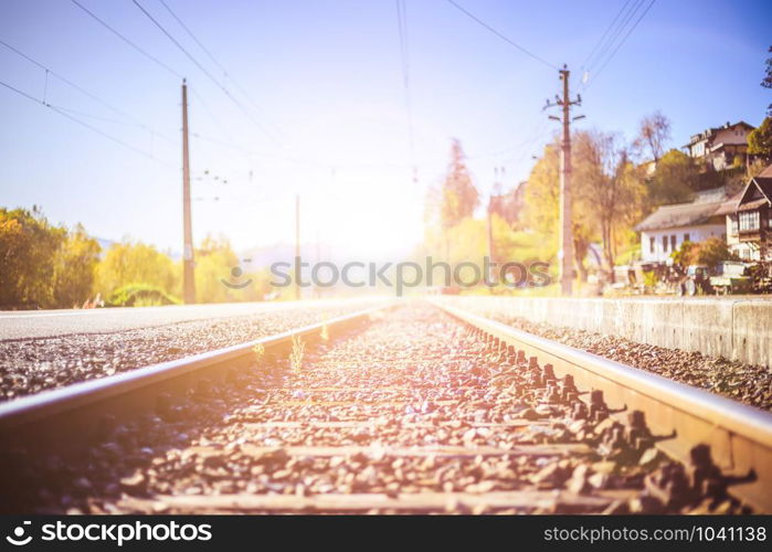 Landscape of an old abandoned railway in fall. Warm light, sustainable traveling