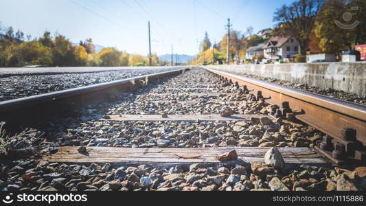 Landscape of an old abandoned railway in fall. Warm light, sustainable traveling