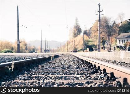Landscape of an old abandoned railway in fall. Warm light, sustainable traveling