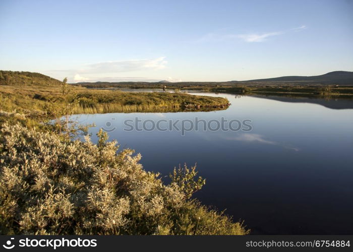 landscape of blue sky and lake