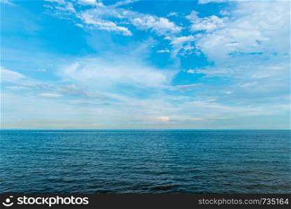 Landscape of calm ocean with clouds sky