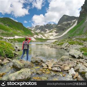 Landscape of Caucasus Dukka lake in mountain. Person and nature. Travel and relax scene.