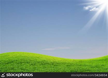 Landscape of green field and blue sky