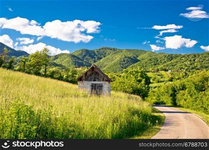 Landscape of green Zumberak hills with old stone cottage, northern Croatia