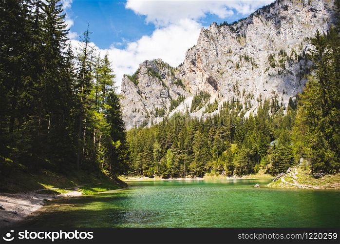 Landscape of Lake in Alps called Green Lake, Gruner See. Place to visit tourist destination. Sunny summer day in Styria, Austria. Green Lake landscape in Styria, Austria. Gruner See place to visit tourist destination.