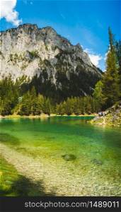 Landscape of Lake in Alps called Green Lake, Gruner See. Place to visit tourist destination. Sunny summer day in Styria, Austria. Green Lake landscape in Styria, Austria. Gruner See place to visit tourist destination.