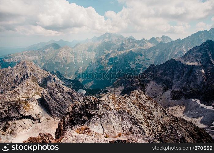 Landscape of mountain peaks, scenery from high summit on wide valley and rough mountain range in the Tatra Mountains