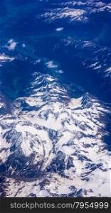 Landscape of Mountain. view from the airplane window. Aerial View of Snowy Mountain.