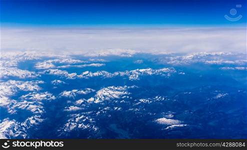 Landscape of Mountain. view from the airplane window . height of 10 000 km. view of blue sky