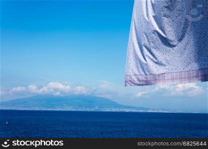 landscape of neapolitan coast fron Sorrento with hanging clothes