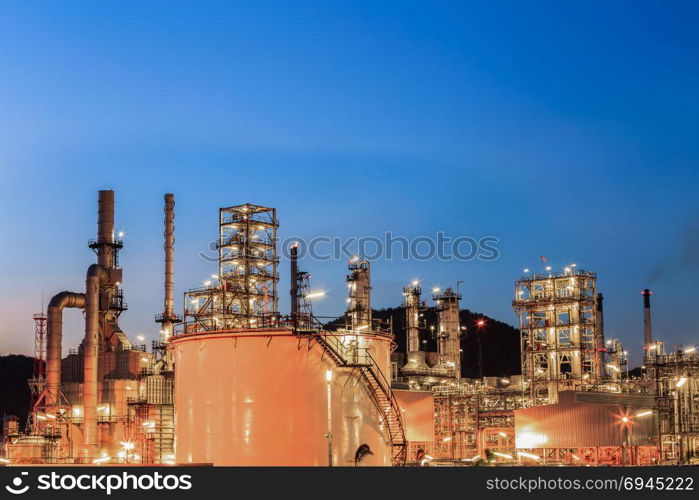 Landscape of oil refinery industry with oil storage tank