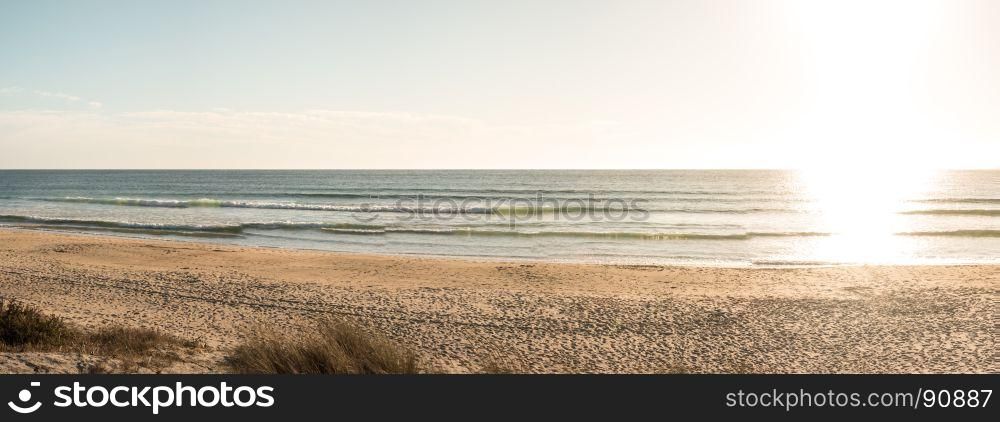 Landscape of Sao Torpes beach, Portugal at sunset.
