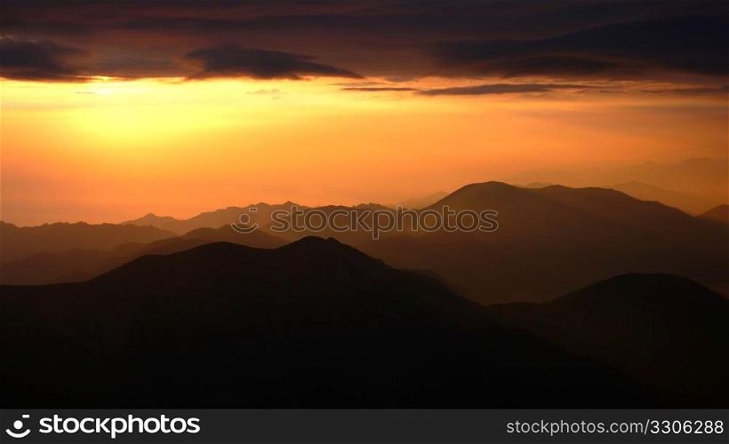 Landscape of sunrise at the top of mountains