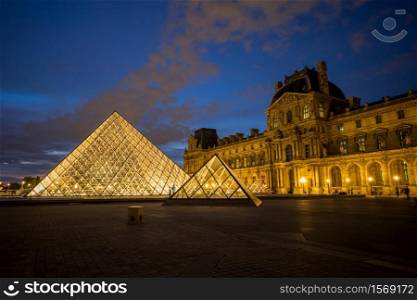 Landscape of the Louvre museum at night, Paris, France