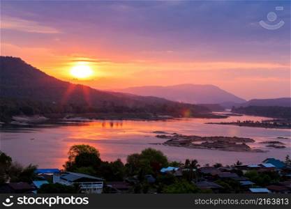 Landscape of the Mekong River at sunrise, fishermen fishing on traditional wooden boats, Khong Chiam district on the riverbank. Thailand-Laos border.