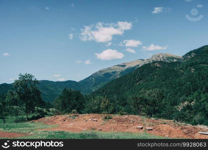 Landscape of the mountains, in Spain. A sunny summer day with green trees