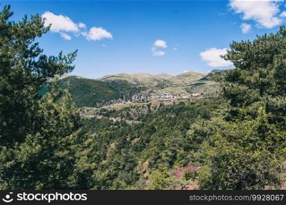 Landscape of the mountains, in Spain. A sunny summer day with green trees