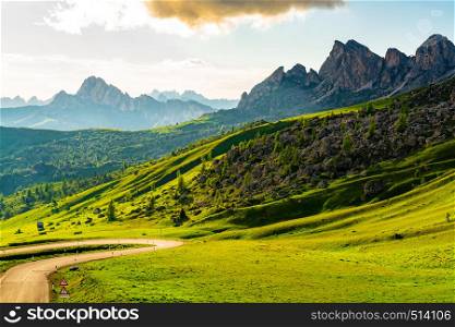 Landscape of the mountains, the forest of pine trees and a rocky hill at the Giau Pass in Italy