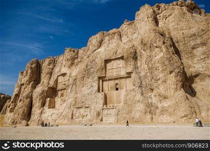 Landscape of the Naqsh-e Rustam shows large tombs cut high into the cliff face. Fars Province, Iran.