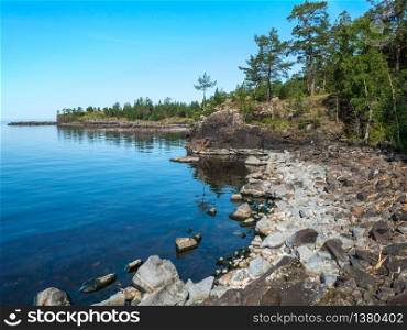 Landscape of the rocky shore of Lake Ladoga. The nature of the North of Russia.. Panorama of the rocky coast of the island.