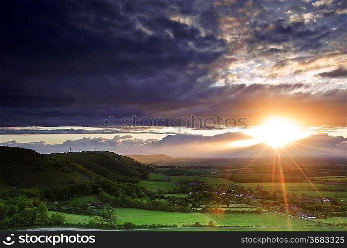 Landscape over English countryside landscape in Summer sunset