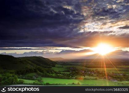 Landscape over English countryside landscape in Summer sunset