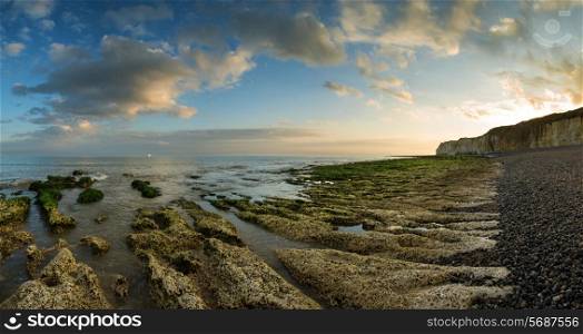 Landscape panorama beautiful sunset over rocky coastline