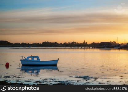 Landscape peaceful harbour at sunset with yachts in low tide