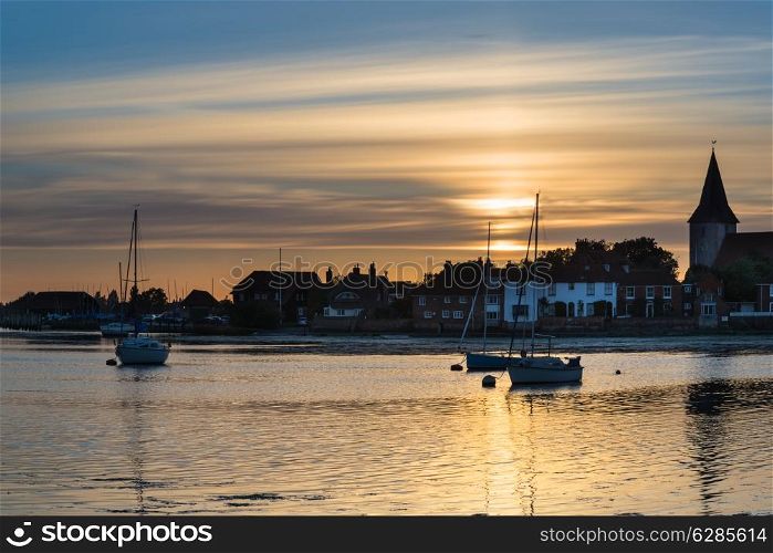 Landscape peaceful harbour at sunset with yachts in low tide