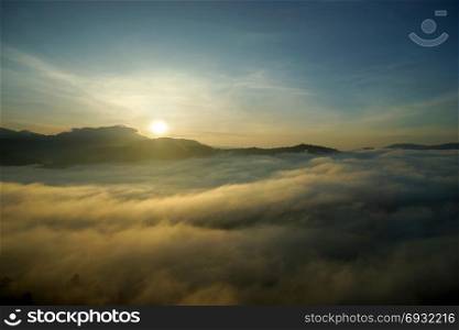 landscape photo, sea fog over the hills with sunrise background