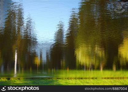 Landscape reflected in water. Nature background.