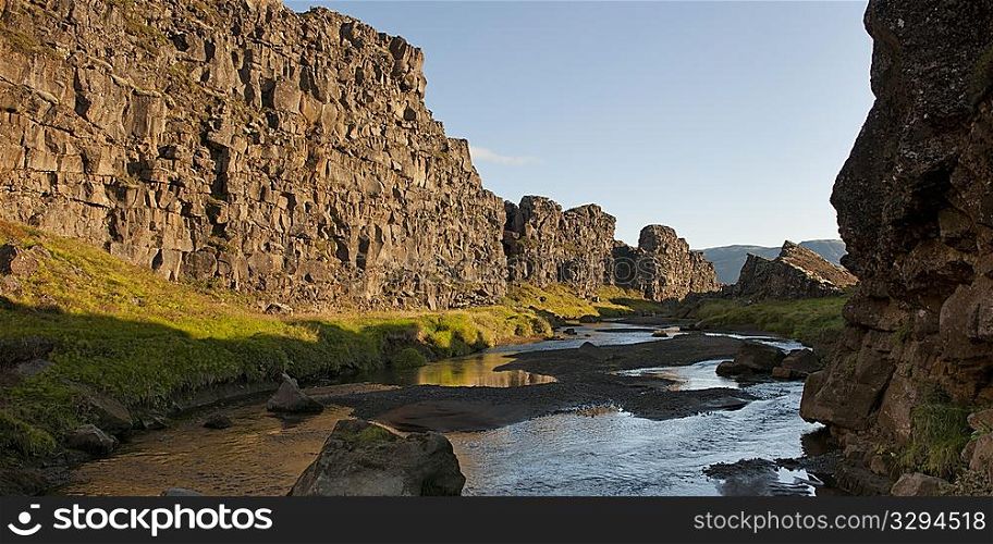 Landscape, river running through steep rugged cliff