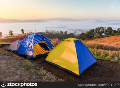 Landscape sunrise beautiful in winter view outdoor travel c&ing tent area on mountain, tourist tent c&ing with fog mist