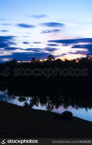 landscape sunset over the tropical lake in Thailand