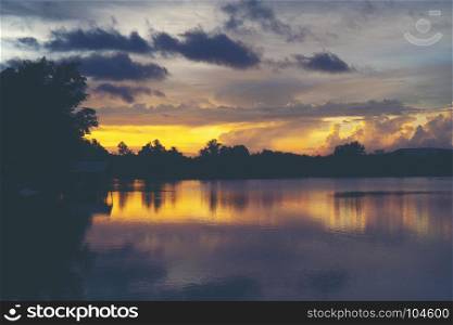 landscape sunset over the tropical lake in Thailand