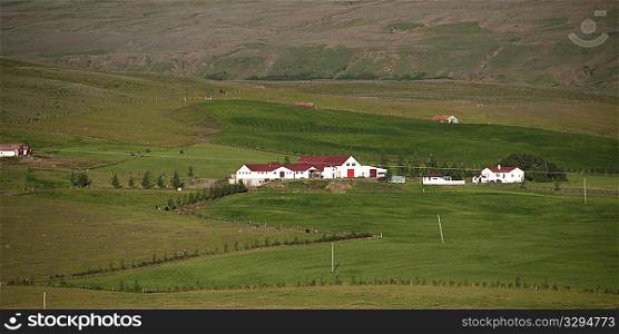 Landscape, verdant farmland with barns