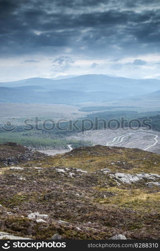 Landscape view from top of mountain on misty morning across countryside