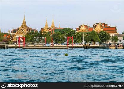 Landscape view of Chao Phraya River with Wat Phra Kaew and Grand Palace in the background. Bangkok, Thailand.