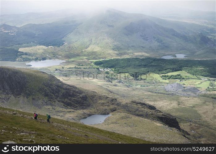 Landscape view of Llyn Cwellyn and Moel Cynghorion in Snowdonia shrouded in fog and low cloud