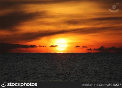 landscape view of peaceful ocean with beautiful sunrise background