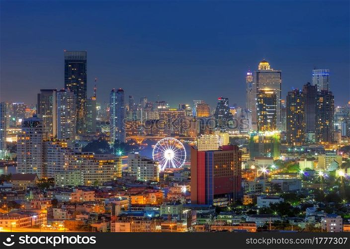 Landscape view of the residential and business district in Bangkok. Ferris wheel is an important point at twilight.. Bangkok Ferris Wheel