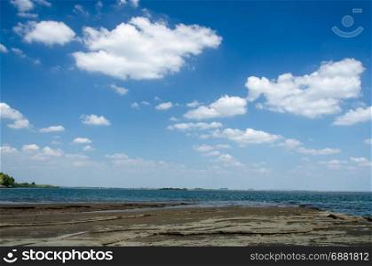 landscape view of the sea, clouds and blue sky.