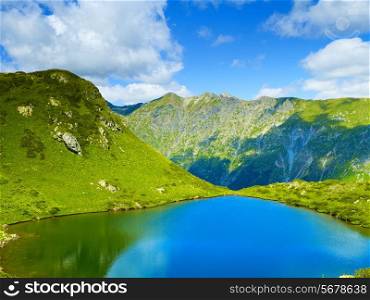 Landscape with a large lake in the Caucasus Mountains