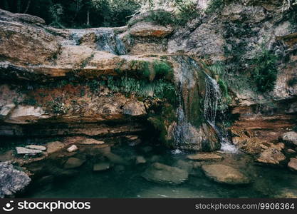 landscape with a pool with waterfall in a place of catalonia, spain